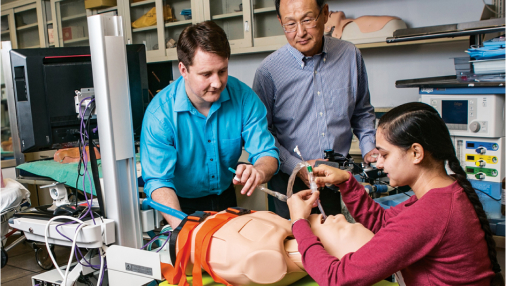 Two students working on a dummy.